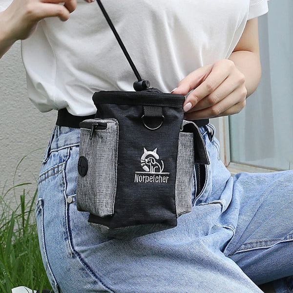 Dog outdoor training bag in black with multiple pockets, made of linen and Oxford cloth, worn around the waist for pet treats and training.